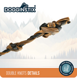 Dog toy with double knots on a mountainous background, featuring the DOGGINSTIX brand. DOG TREAT SALE